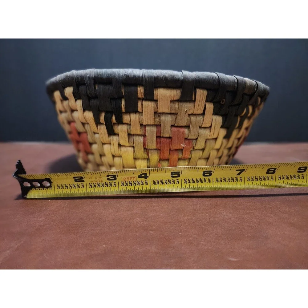 This handmade, round basket resembles those traditionally crafted by artisans.